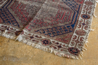 Antique Baluch. This is a very old and very worn Persian Baluch. It has a central Asian flair.

width: 2'5"
length: 4'7"
size category: 3'x5' and smaller
dominant colors: Red, Blue & Beige    