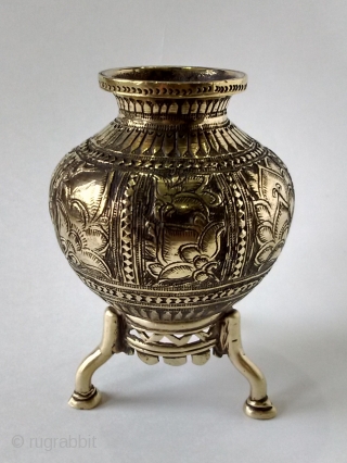 A very fine, cast brass holy water pot, with very fine and intricate flower workmanship. 3 different flowers all around pot. Pot with stand of brass as well. Height with stand: 11.3  ...