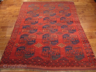 Antique Ersari, great red, nice yellows, blues, greens, burgandy. The rug is complete, but has some visible wear. Its a nice square size that measures 6'10'' x 8'6''Hard to photograph but the  ...