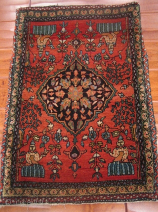  Antique Fereghan Sarouk with two different types of genies? In great original condition. This flying Persian carpet measures 1'9'' x 2'6''.           