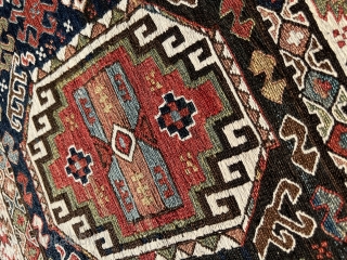 This side panel woven in the sumakh technique by the Khamseh Shahsavan once formed part of a mafrash. In the dark blue field adorns a rectangular Memling-gül, its outline accentuated by white  ...