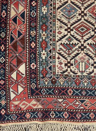 Shirvan prayer rug
This East Caucasian prayer rug shows a characteristic diamond lattice design of dark blue serrated leaves enclosing flowering shrubs in its white field containing the bridge-shaped prayer arch at the  ...