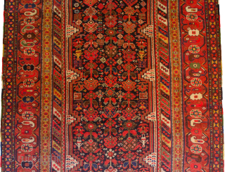 Antique Khamseh Carpet 353x180cm with vibrant colours and crisp drawing in good conditioin.

More info: https://sharafiandco.com/product/antique-khamseh-carpet-353x180cm/
                  