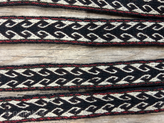 An impressive antique Qashqai narrow tent band. It seems to be for tying loads on camels and horses. The pom-poms at each end add so much charm to the piece and suggest  ...