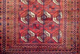 Unusual antique Baluch rug 217x130cm with a Turkman design woven on wool. The colour is mainly soft red with a beautiful shade of green in the border.  In generally good condition  ...