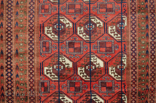 Unusual antique Baluch rug 217x130cm with a Turkman design woven on wool. The colour is mainly soft red with a beautiful shade of green in the border.  In generally good condition  ...