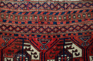 Unusual antique Baluch rug 217x130cm with a Turkman design woven on wool. The colour is mainly soft red with a beautiful shade of green in the border.  In generally good condition  ...