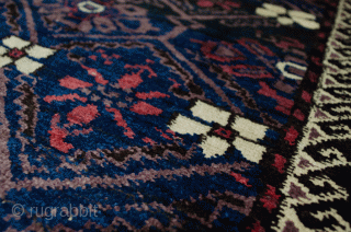 Unusual antique Baluch rug 217x130cm with a Turkman design woven on wool. The colour is mainly soft red with a beautiful shade of green in the border.  In generally good condition  ...