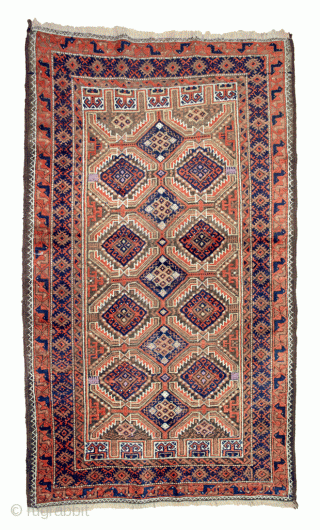 Decorative antique Baluch rug 163x95cm. The all over lozenge design on a light green background, with four niches at either end, is framed with a blue border and an interesting peacock terracotta  ...