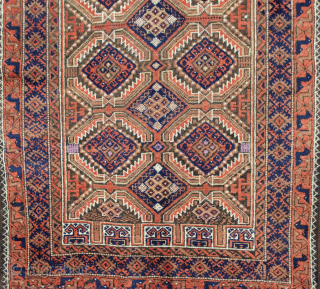 Decorative antique Baluch rug 163x95cm. The all over lozenge design on a light green background, with four niches at either end, is framed with a blue border and an interesting peacock terracotta  ...