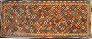 12941 Antique Bakhtiar Kilim 528x215cm Circa 1900 Magnificent antique Bakhtiar kilim. Multi coloured lozenge ground encased in a three layered border. Bakhtiar region is known for its use of natural dyes in  ...