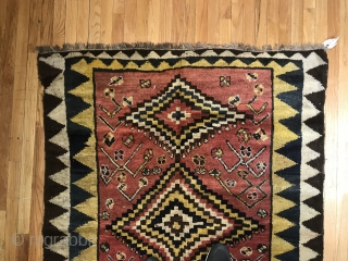 Gabbeh  type longish rug. Some zig zags. As found, sporadic repairs.                     