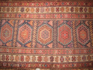 An uncommon Kurdish Long Rug with 11 or so medallions.                       