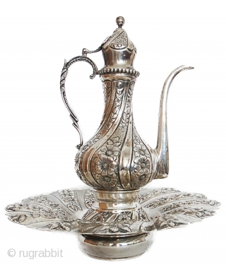 AN OTTOMAN SILVER EWER AND BASIN, PROBABLY EGYPT, 19TH CENTURY 


Condition Report :  Ectremly fine head cover attached with handle is broken and repaired in its original condition    