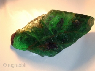 A beautiful large piece of green flourit stone extremly rare piece very clear and transparent . 2 kg               