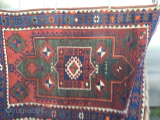 Old Fachralo Kazak rug with one Medellin of double head.
It has beautiful green field+warm colores.
Size 143cm x 200cm. it is in a good condition

Price €2750 including shipping and Ins.

Stephan Athir pages  