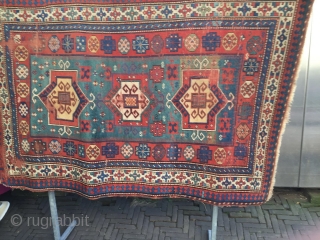 Old fachralo kazak rug with 3 medellin, attractive colores,with green field size 139cm x 205cm filled with art work.it can be use directly as a very rare fachralo after good cleaning or  ...