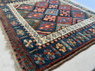Late 19th century Kurdish Jaf bag face, that has been sewn onto a hessian wrapped wooden frame.   This can be hung on a wall as a piece of rug art.

The  ...