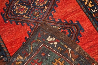 Geometric Persian runner, 10' x 4'. I believe circa 1900. One significant repair (~5 inches, pictured), pictured. Other small areas worn.            