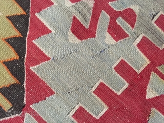 Large Turkish Kilim rug c. 1900. Vibrant colors, some small repairs as pictured in 4th photo. Braided fringe. Clean and odor-free, includes tags from professional cleaner and art gallery where purchased. 

5'9"  ...