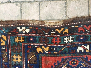 Geometric Persian runner, 10' x 4'. I believe circa 1900. One significant repair (~5 inches, pictured), pictured. Other small areas worn.            