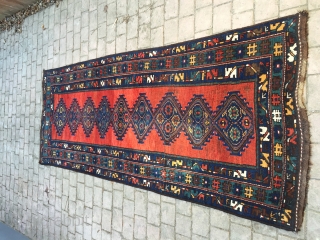 Geometric Persian runner, 10' x 4'. I believe circa 1900. One significant repair (~5 inches, pictured), pictured. Other small areas worn.            