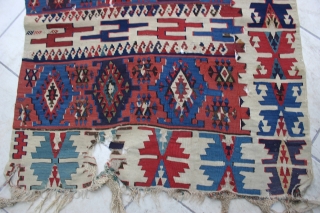 

Antique Reyhanli Kelim, circa 1800. Size: 12' x 3'. Condition "as is"; there are various small tears and small holes. The majority of the wear is from the corrosion of the browns,  ...