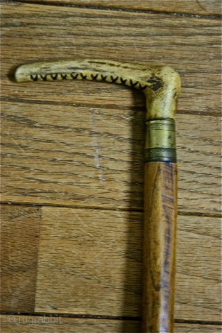 This is an old Buzkashi whip, most likely 19th c., carved from one shaft of wood into 4 separate bent wood braided branches; it is completely hollow in the center. The carved  ...