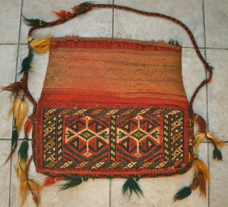 Antique Yomut Torba, (spindle bag?)
Circa Last Qtr. 19th c.
Size: Pile is 51 cm. x 23 cm. Kelim is 49 cm. x 23 cm.
Condition: EXCELLENT, Full Pile, tassels are original and largely intact.
The  ...