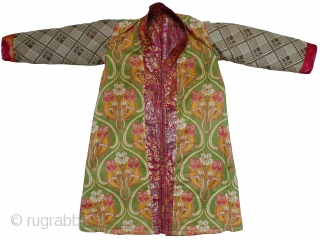 Uzbek Brocaded Boy's Robe. Russian silk brocade with gold and silver metallic threads. Russian Art Nouveau printed-cotton lining. Good condition except for some wear to the metallic threads; fading to the center  ...