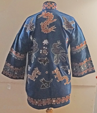 very traditional ethnic chinese Miao minority jacket...with tie front closure...all hand embroidered applique work...very wearable 
approx 50 years old              