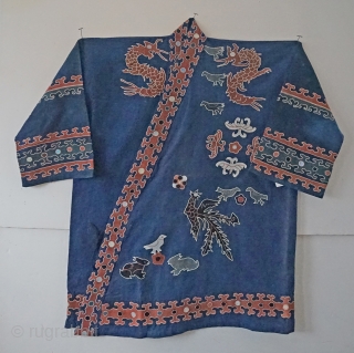 very traditional ethnic chinese Miao minority jacket...with tie front closure...all hand embroidered applique work...very wearable 
approx 50 years old              