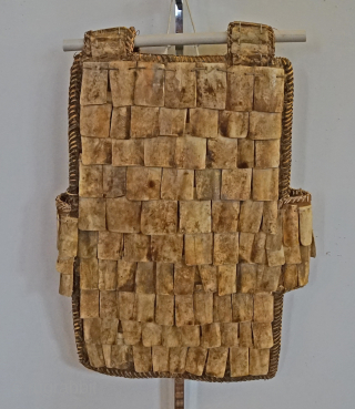 Indonesian warrior Vest from the Toraja people of Sulawesi Island.   Made from water buffalo bone, and sewn together with woven rattan plant fibers. the vest makes great wall display. mid-20th  ...