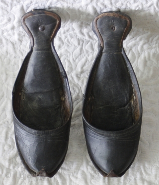 Misc 175 
This antique pair of Hand made leather are the old traditional shoes which were worn in Turkey. They were called Charoog...spelling may vary. The soles are concave and curl to  ...