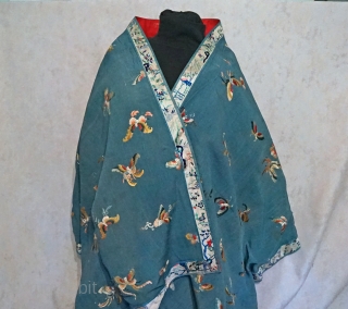 Antique Large Hand Embroidered Chinese silk shawl panel
All over pattern of multiple assorted butterflies...wedgewood blue silk crape fabric surrounded with embroidered border...entire piece is lined with red cotton fabric... 
measures roughly 27  ...