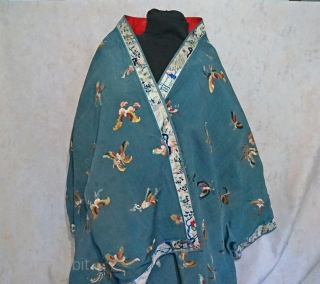 Antique Large Hand Embroidered Chinese silk shawl panel
All over pattern of multiple assorted butterflies...wedgewood blue silk crape fabric surrounded with embroidered border...entire piece is lined with red cotton fabric... 
measures roughly 27  ...