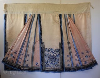 Qing Dynasty  CHINESE SILK SKIRT.

This soft pale pink colored antique Chinese silk skirt is from the late 1800's. The over all traditional embroidery mainly uses satin stitch technique. But the large  ...