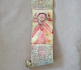 This is a traditional Antique Coptic Christian scroll from the Oromo people of Ethiopia. Painted on Vellum (processed animal skin) and using a special black and red ink, the text is in  ...