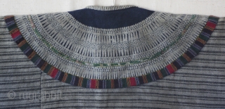 EMT #150   This was the traditional jacket used by girls of the Yi Chinese ethnic Minority. Girls wore this style until they were married. This garment is small and was  ...