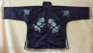 TC279  This small silk jacket was made and worn by the child of a wealthy traditional Han Chinese family. The dark blue silk fabric is embroidered on the front and back  ...