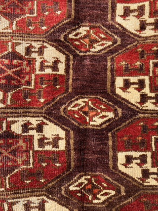 Antique Chodor Turkmen carpet, 5'7 x 10'1, 1850-1880. Wool goat hair warps and white cotton wefts typical of Chodor weavings. Thick, velvety pile in saturated deep burgundy red, purple, and soft, khaki  ...