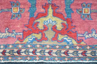Antique Malayer with rare field design on pink ground, beautiful turquoise green border. 145 x 78 cm                