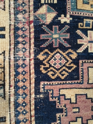 East caucasian carpet with Leshgi stars, 19th.C. 110 x 209 cm. Some old repairs, cuts and partially very worn.              