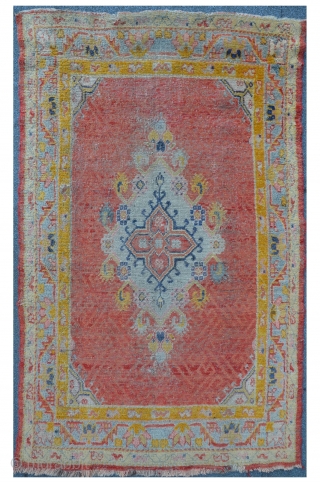 Exceptional West Anatolian Carpet with an Ushak type Medallion. The field is ornamented with different shades of apricot. Some damages on the upper right side. 173 x 106 cm    