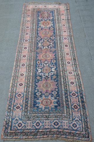 East Caucasian Leshgi, green ground Kufi border, 354 x 134 cm, a twin piece is illustrated in Doris Eder's "orient carpets" vol. I. Caucasian plate 433       