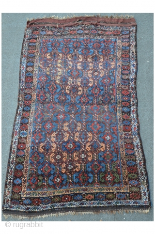 Kordi 244 x 148 cm, meaty floor with shiny colors. As found condition with some damages on the lower end.             