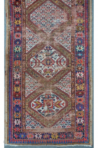 NWP Kurdish rug with camelhair border, 347 x 121 cm, some old re-knotting with faded away colors, beautiful drawings.              