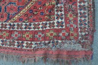 Antique Beshir mounted on cloth, 240 x 150 cm, lots of home made old repairs, corroded brown. Rare design with beautyful colors. First half 19th.        