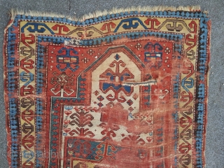 Fachralo Prayer rug. 100 x 157 cm, second half 19th. A damaged beauty in as found condition.                