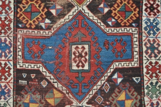 Lovely Kazak from south Georgia / Caucasus. Beautiful abrash in the outer blue-green border. High floor, but some places much worn, 191 x 107 cm        